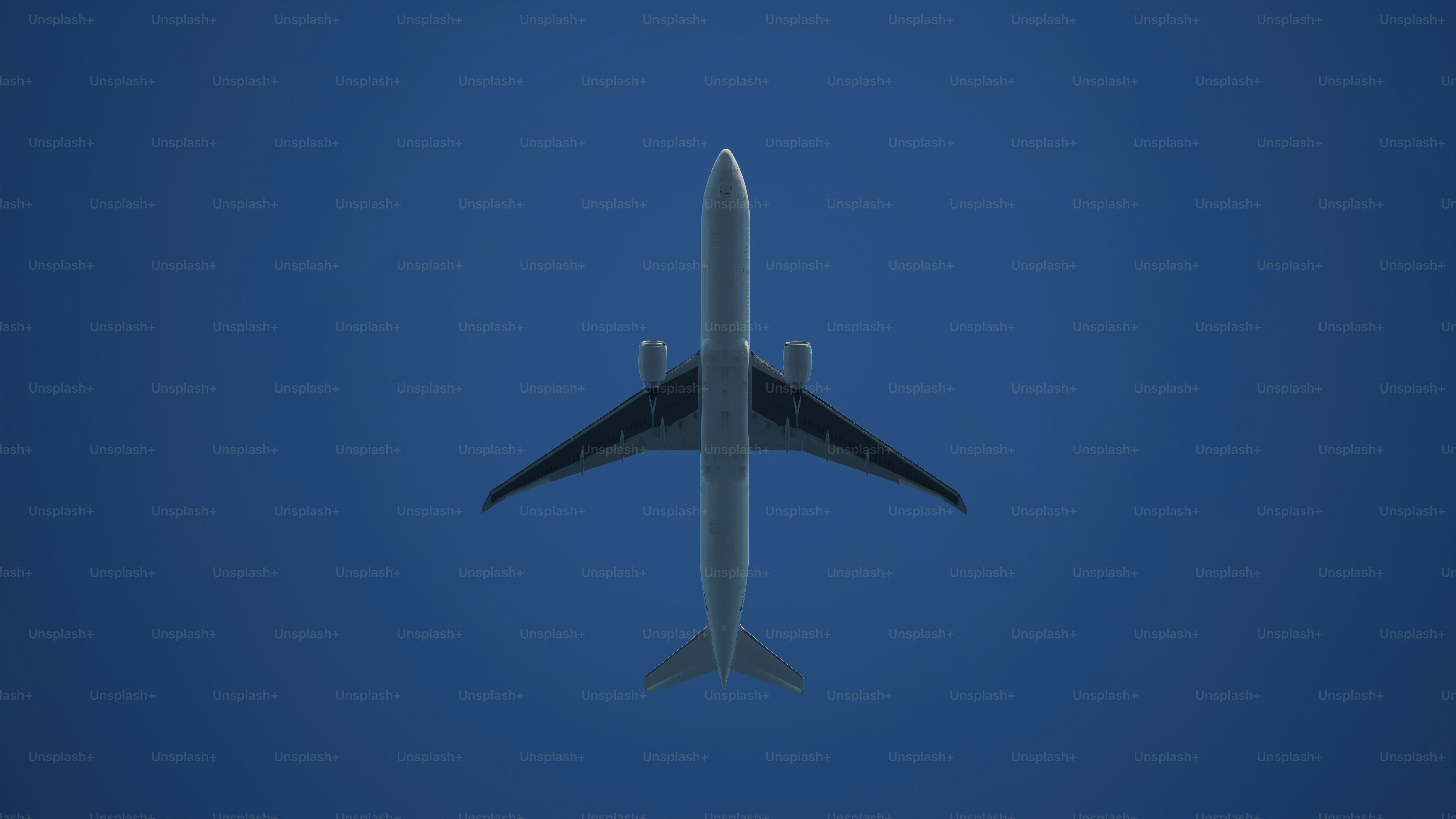 a large jetliner flying through a blue sky